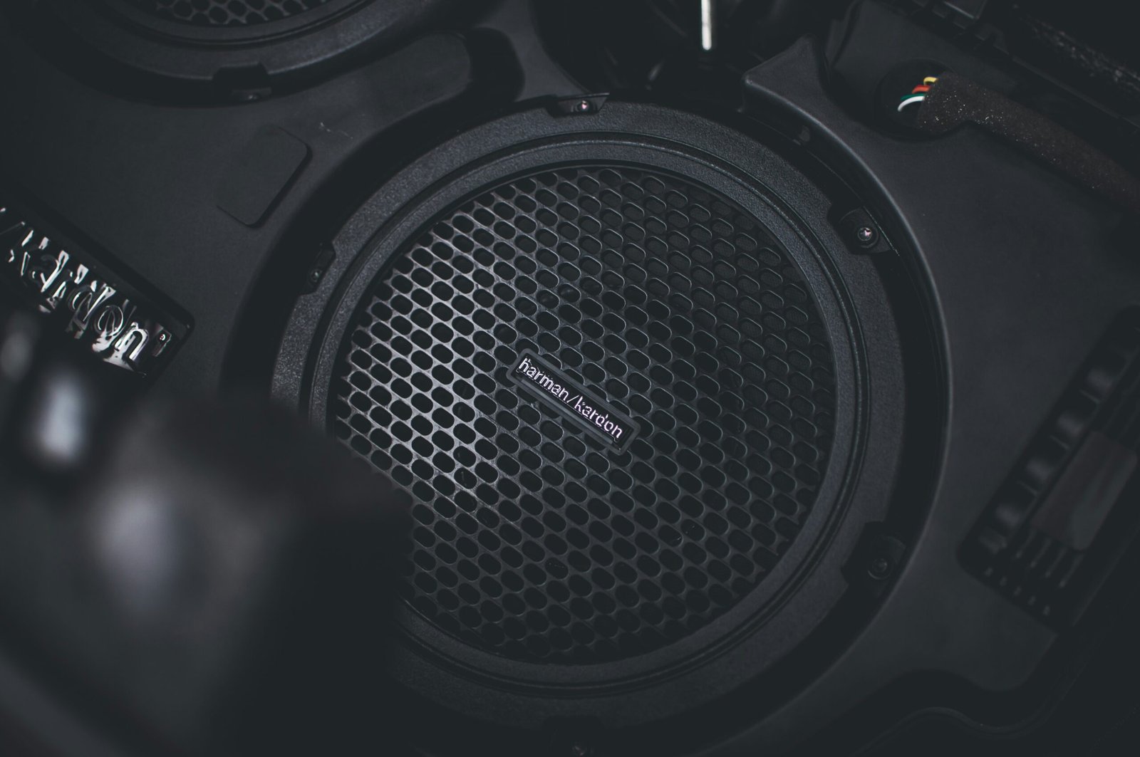 a pair of headphones sitting on top of a speaker